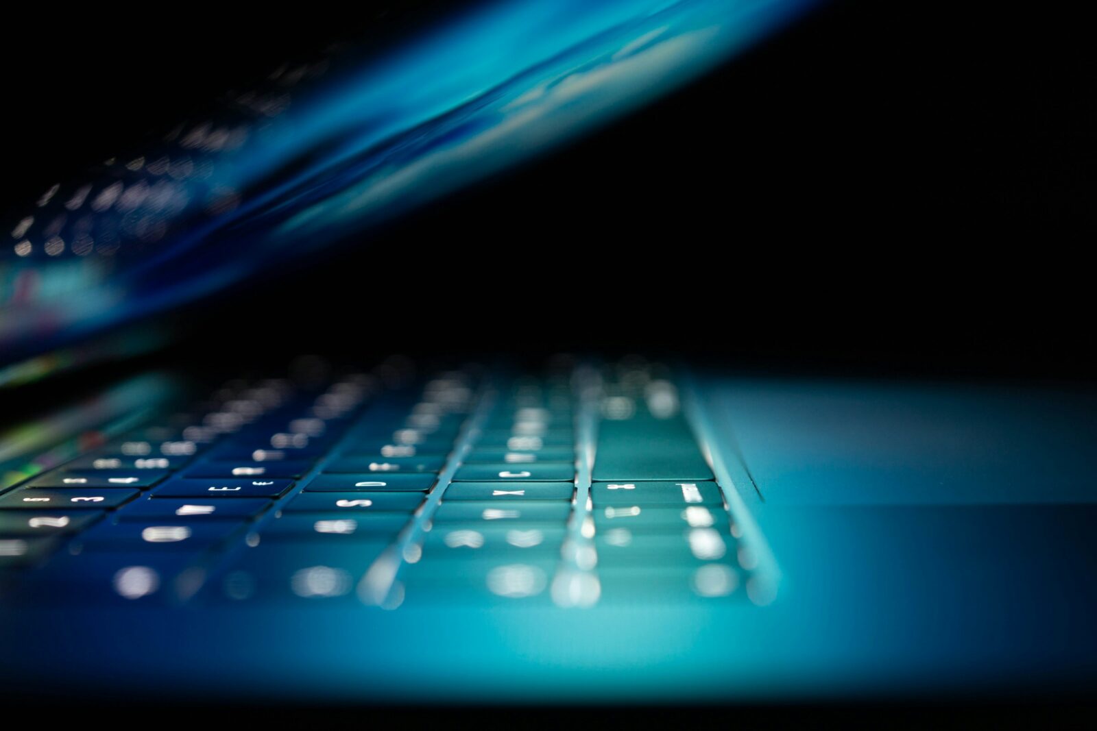 closeup photo of turned on blue and white laptop computer