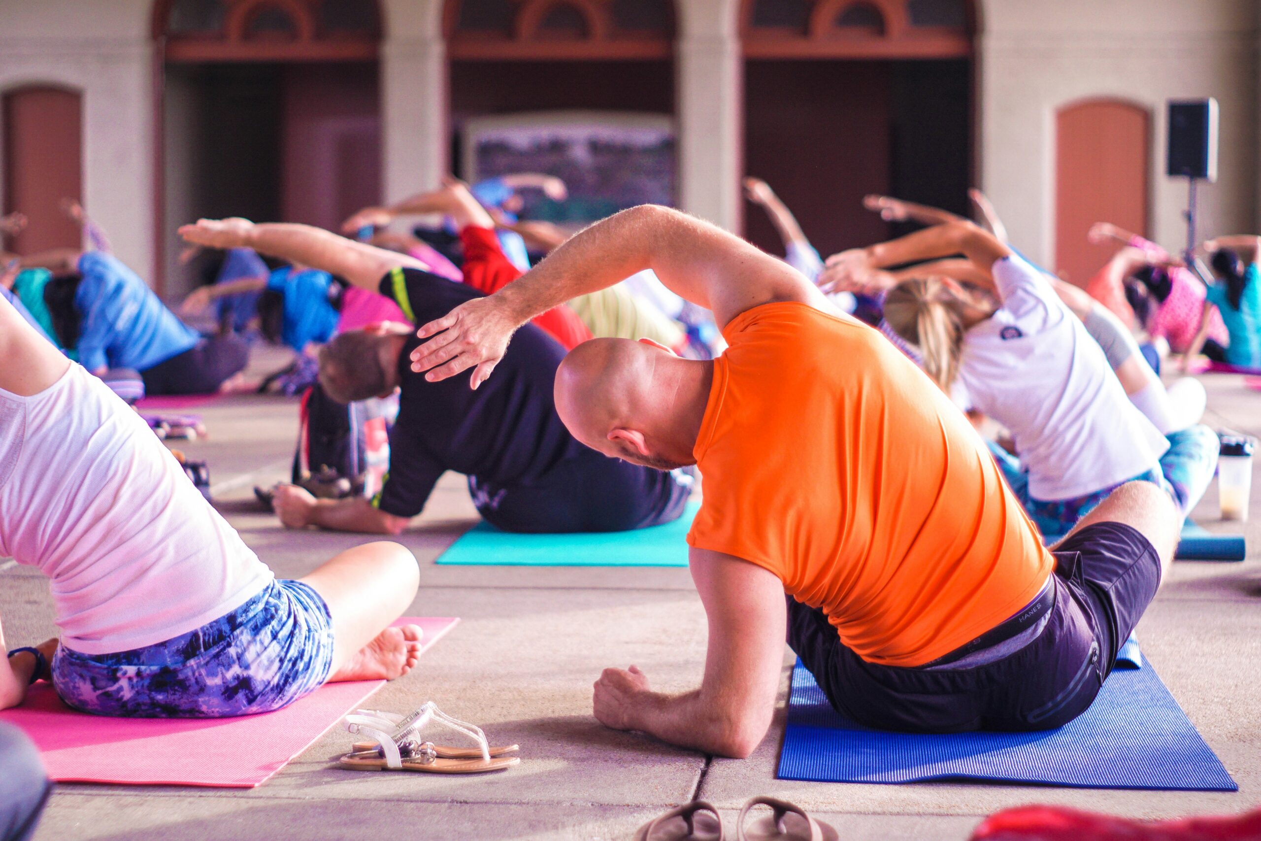 People in a Yoga Class Stretch