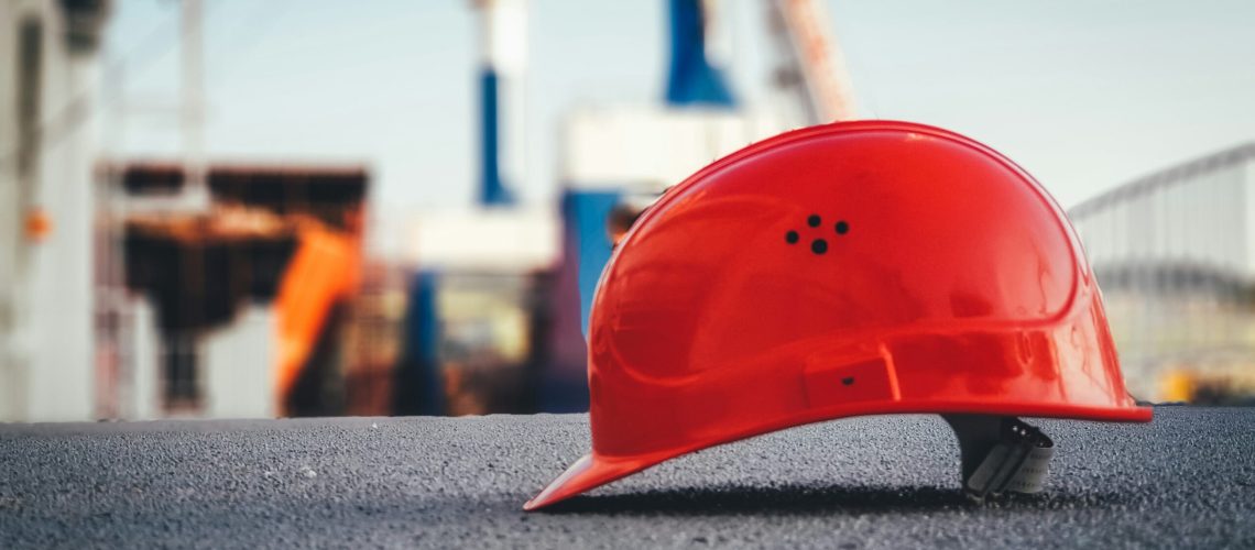 construction red helmet on concrete